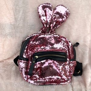 Pink backpack with bunny ears.